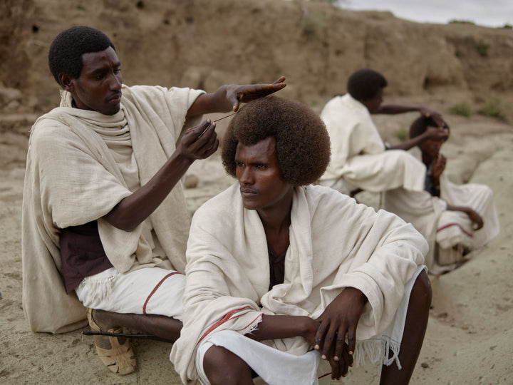 Ethiopia #2 - Fentale receives Kereyu hairstyle from Umer. 
Metahara, Oromia Region, Ethiopia